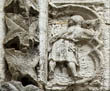 Panel 14:14 - Man in short tunic with his back to the viewer carrying a dish (?)